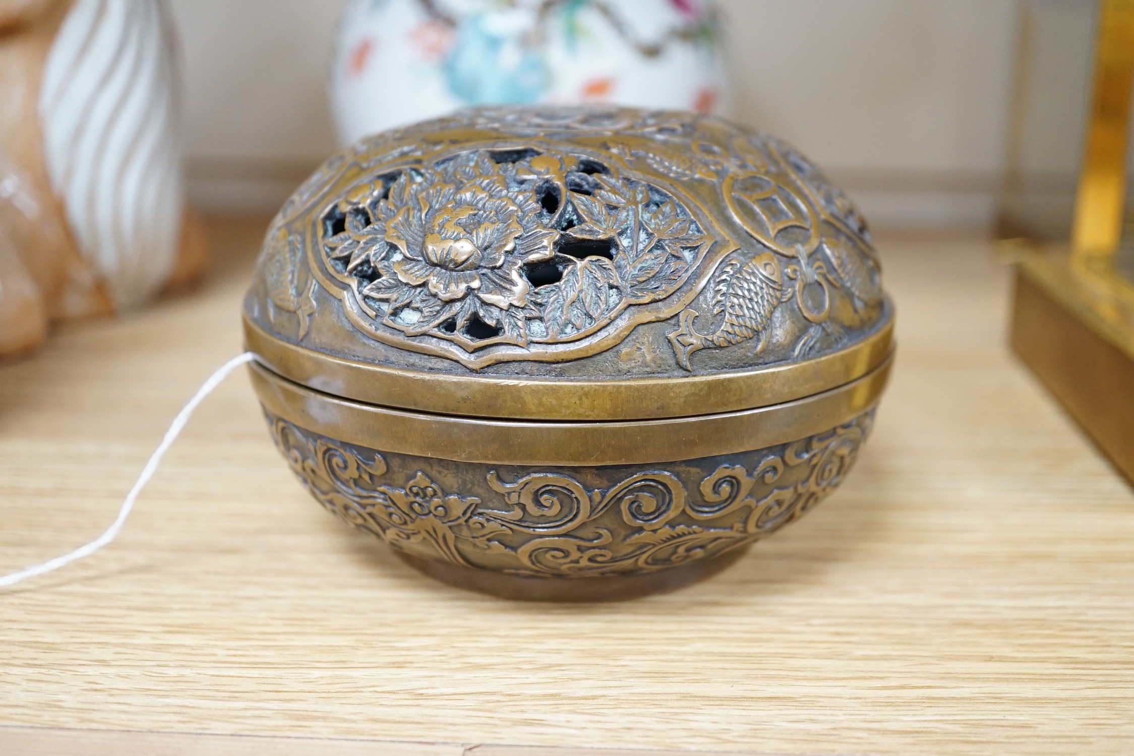 A Chinese circular carved bronze censer, 13.5cm diameter